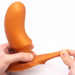 Oversized soft anal plug in the rear court