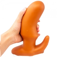 Oversized soft anal plug in the rear court