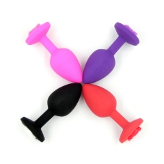 Small silicone with gold pink rose back anal plug
